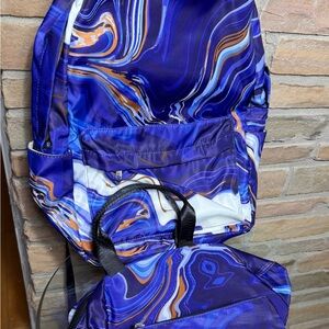 Purple black swirl design on 3 piece backpack, lunch bag and pencil case. Meijer